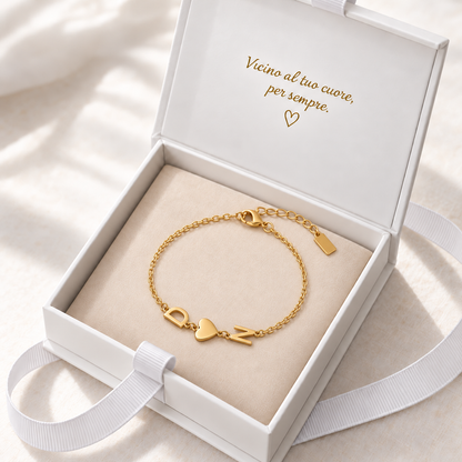 Bracciale Trama dorato nella confezione — iniziali laterali D cuore N